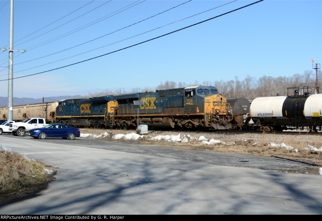 An EB grain train meets H763 in the siding at Reusens